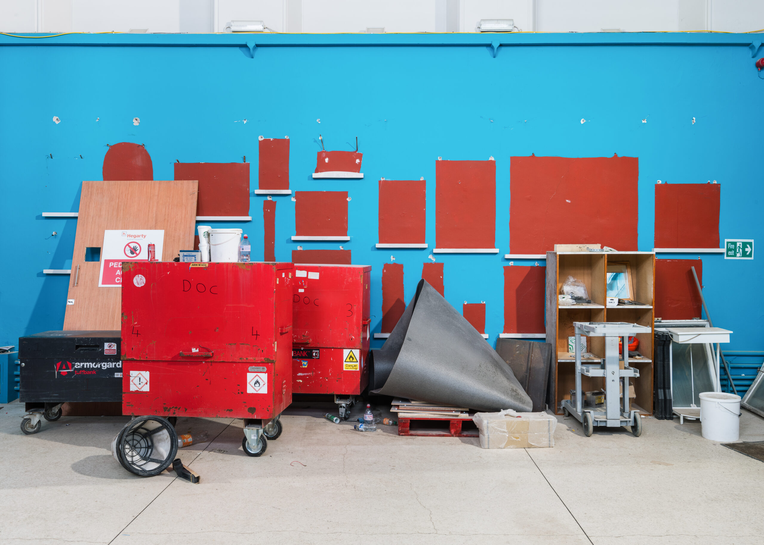 Red cases in an empty room