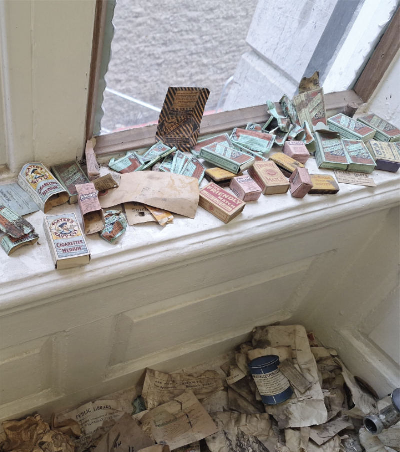 Cigarette boxes on a window cill.