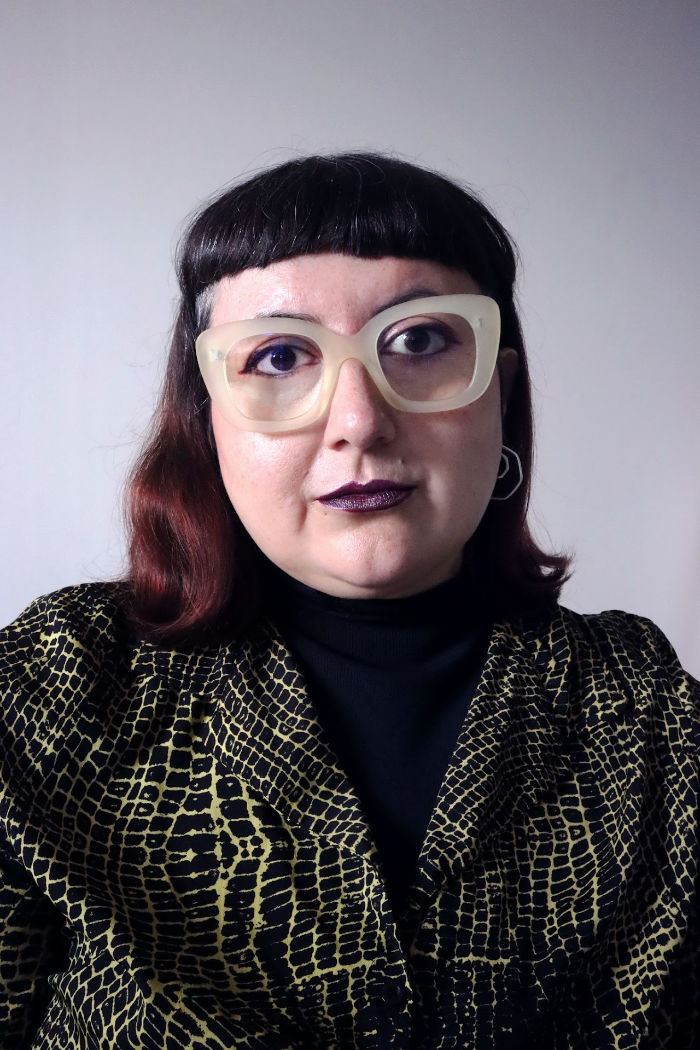Photo of a female artist with glasses