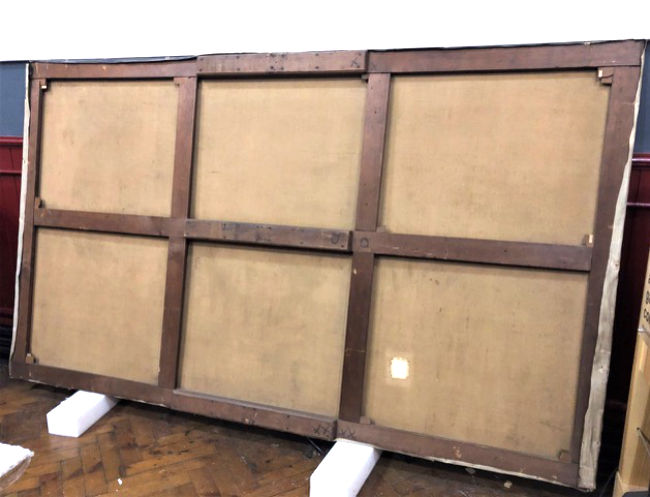 Verso (reverse) of the canvas on 6-bay wooden stretcher with one horizontal, two vertical cross bars, and fourteen wooden keys.