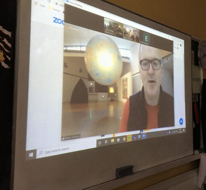 Denis Connolly giving a virtual exhibition tour to a school group.