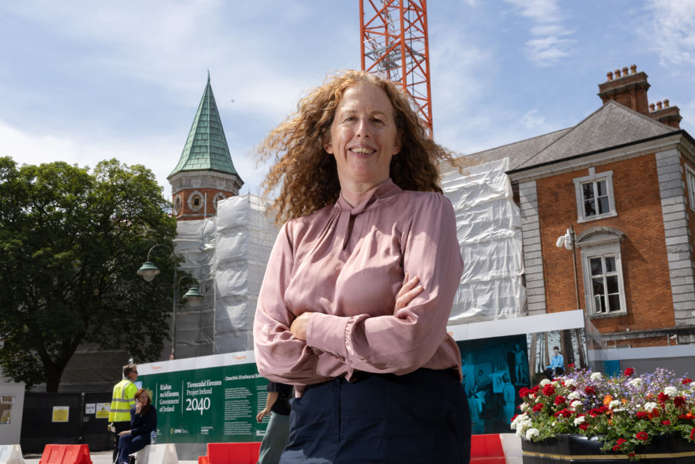 A woman in front of a building