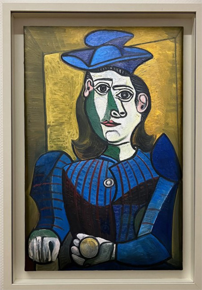 Abstract painting of a woman in blue.