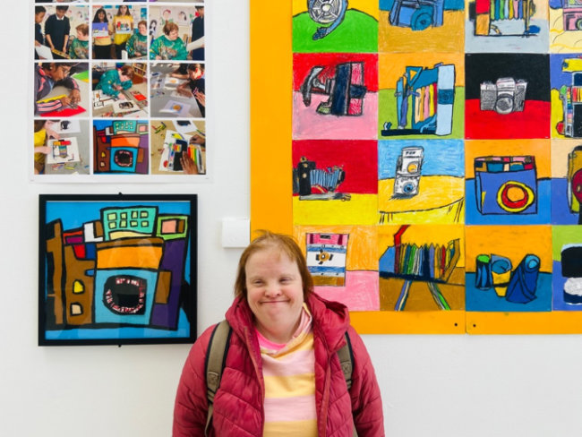 Art exhibition featuring colourful artworks.