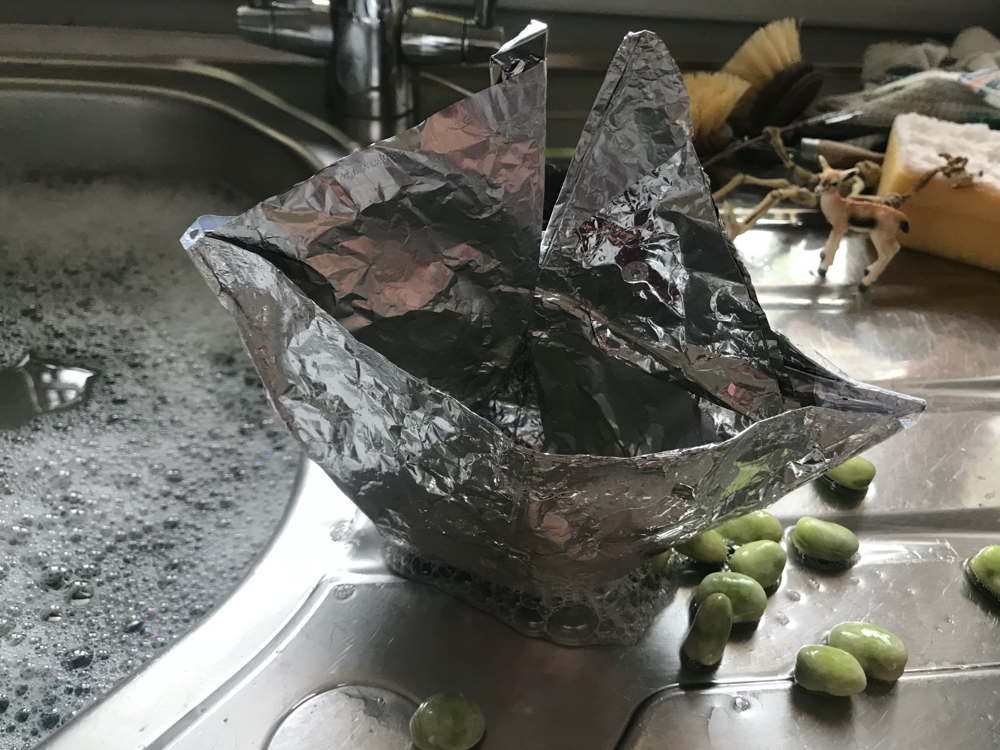 Tinfoil boat on sink