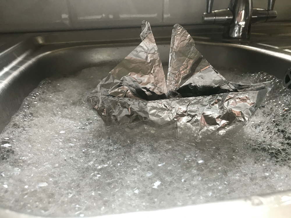 Tinfoil boat in sink