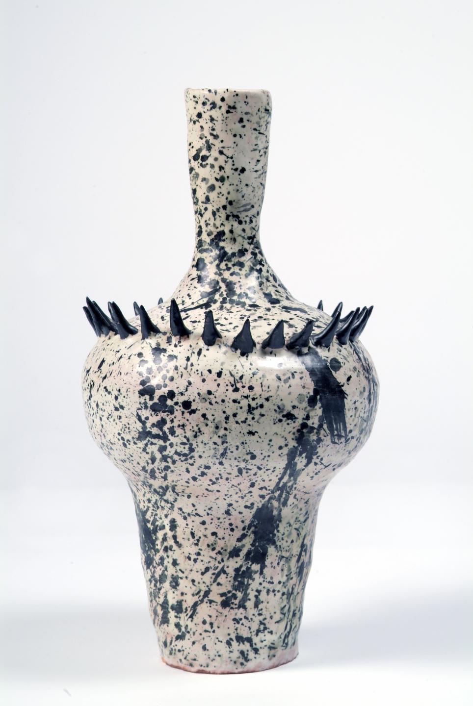 John Ffrench, Vase (green with black and grey speckled markings), 1960, ceramic, 28 x 6.5 cm. Presented, 1990. © the artist’s estate.